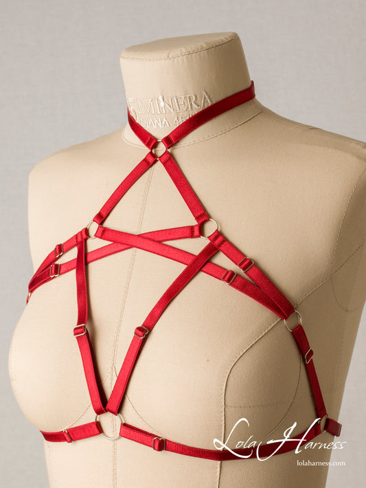 Front-side view of the Alice harness cupless bra with a choker, featuring a bold strappy cage design in red elastic.