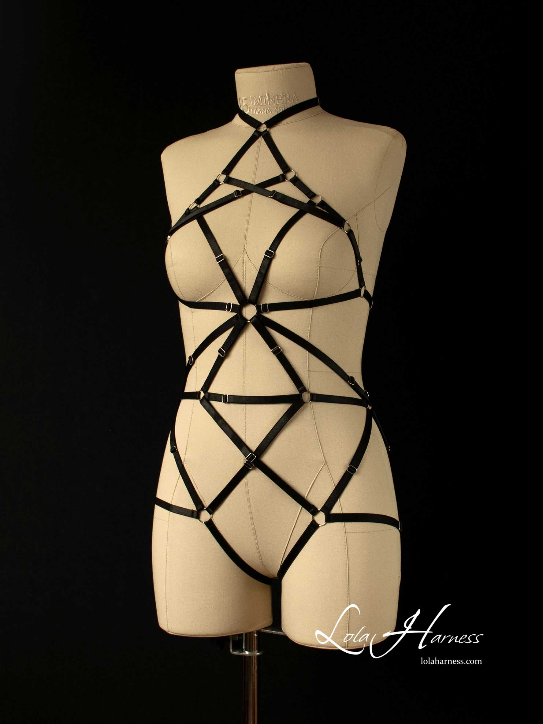 Black cage-style harness bodysuit with choker, front side view on mannequin.