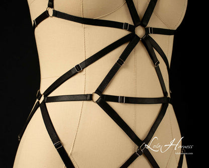 Detailed shot of the black harness bodysuit stomach area with cage design.